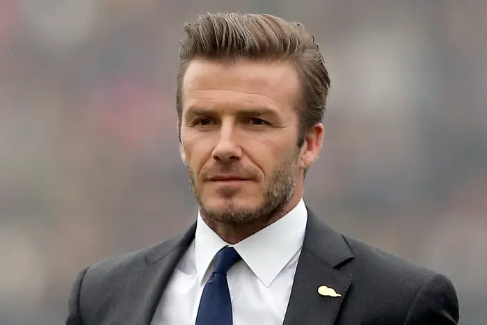 David Beckham at a public event showcasing his successful football and business career.